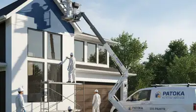 Professional house painters working on residential exterior in Evansville, IN