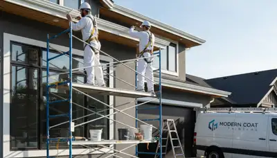 Professional trim and fascia painting on a home exterior in Evansville, IN by expert house painters